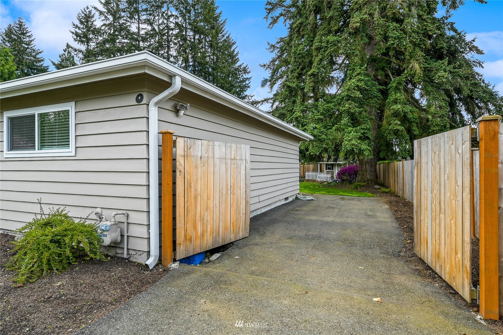 17341 Southeast 134th Street Renton, WA 98059 - Photo 31 of 36 a view of a house with a yard and garage