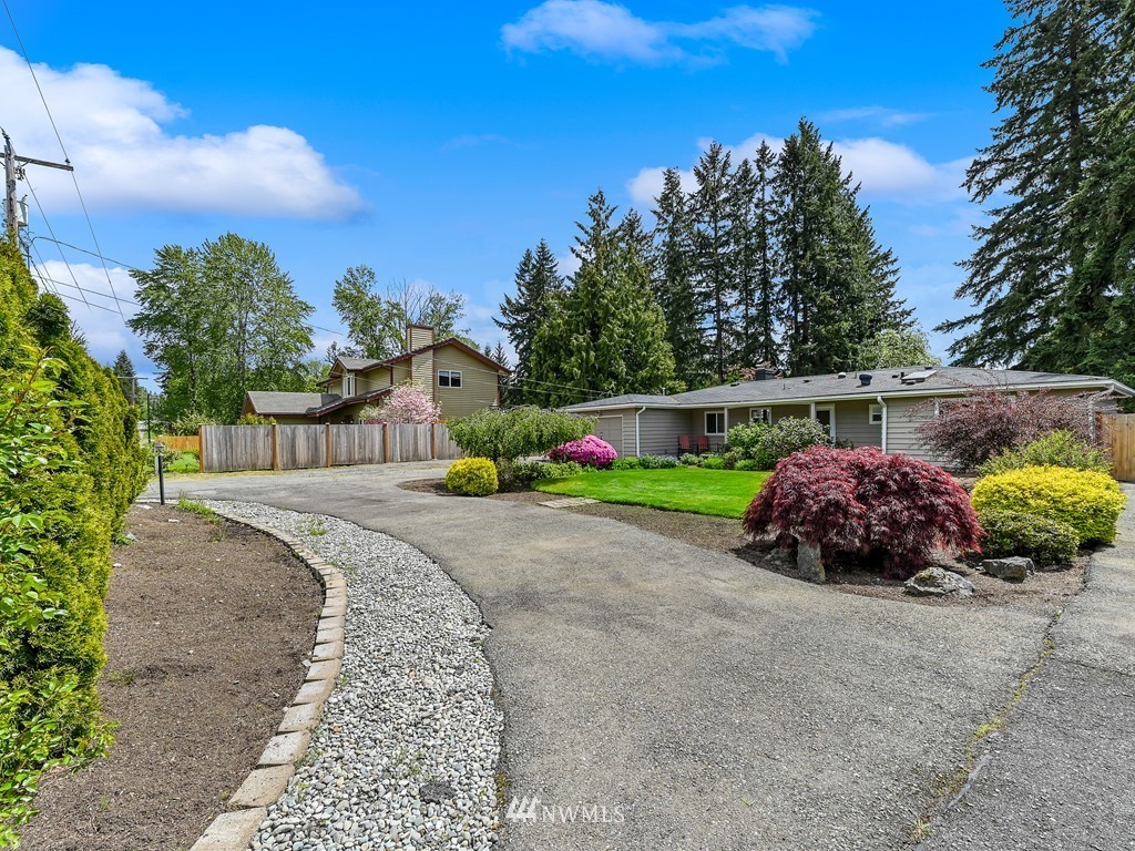 17341 Southeast 134th Street Renton, WA 98059 - Photo 34 of 36 a front view of a house with garden