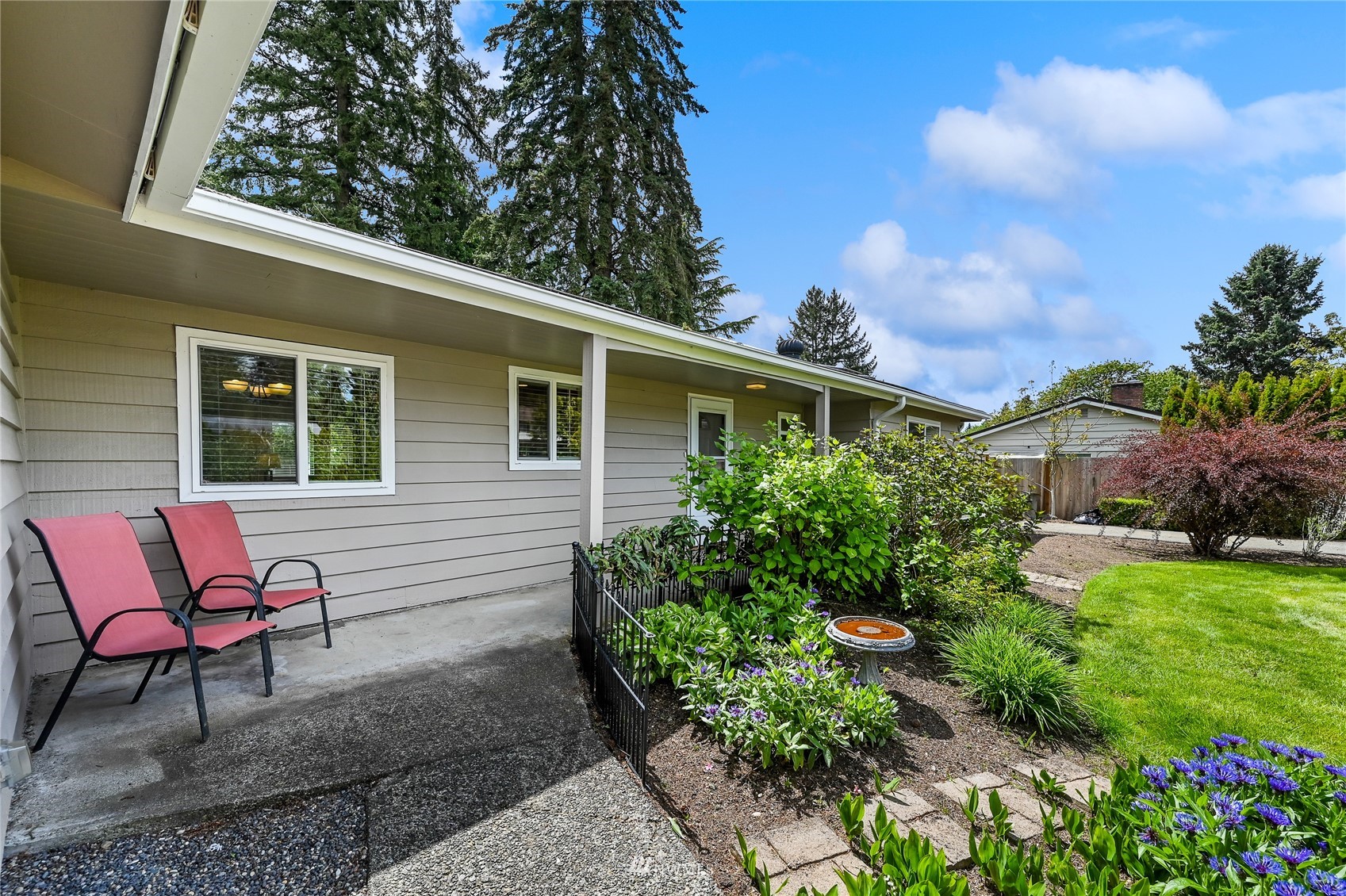 17341 Southeast 134th Street Renton, WA 98059 - Photo 4 of 36 a backyard of a house with table and chairs