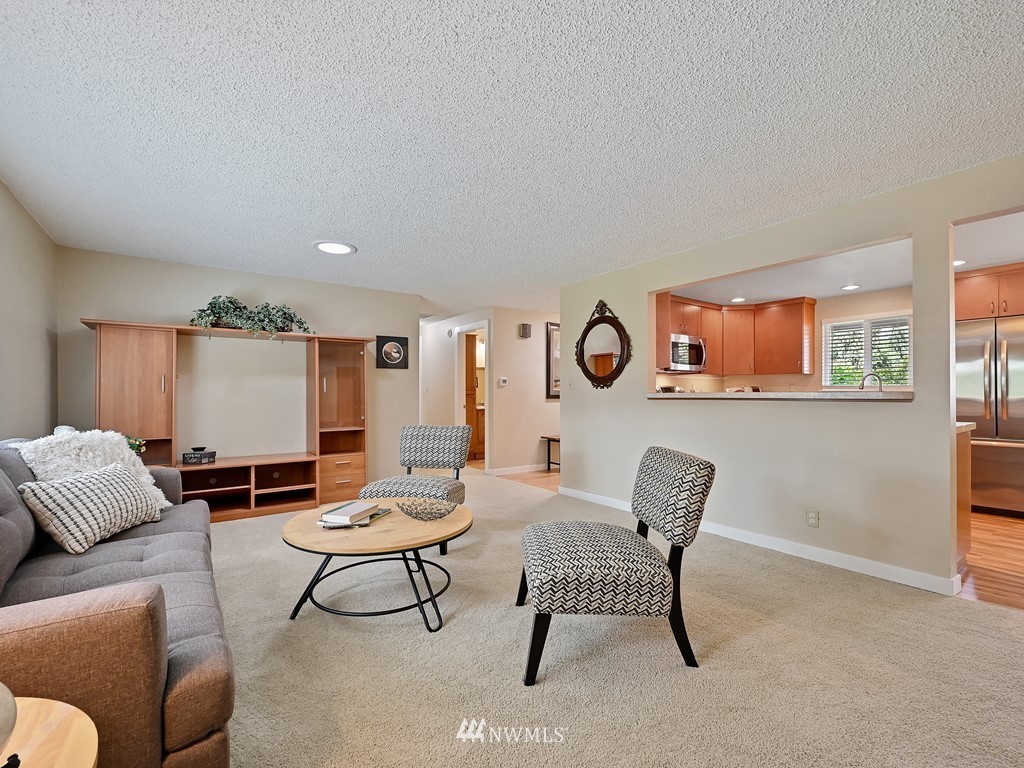 17341 Southeast 134th Street Renton, WA 98059 - Photo 7 of 36 a living room with furniture and a large window