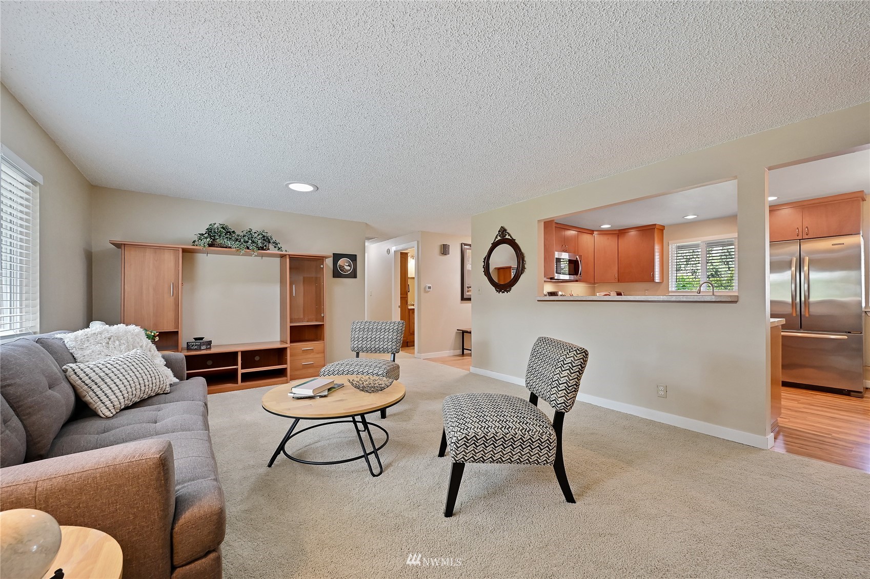 17341 Southeast 134th Street Renton, WA 98059 - Photo 8 of 36 a living room with furniture and a large window