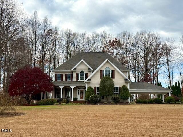 534 Dink Ashley Road Timberlake, NC 27583 - Photo 2 of 86 a front view of a house with a yard covered with trees