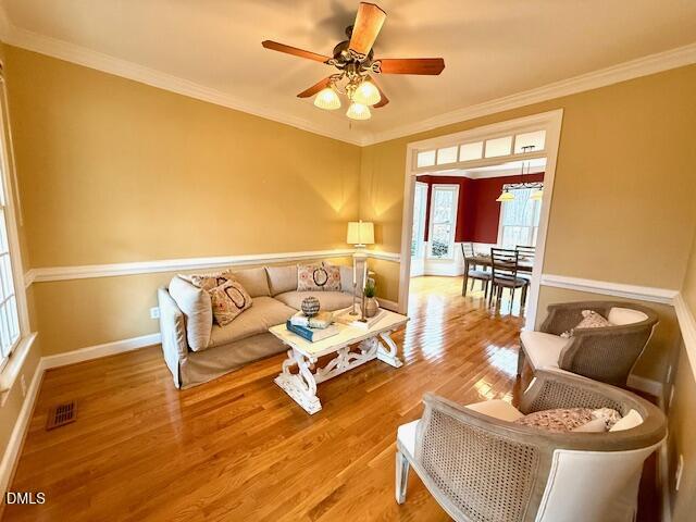 534 Dink Ashley Road Timberlake, NC 27583 - Photo 24 of 86 a living room with furniture and a wooden floor