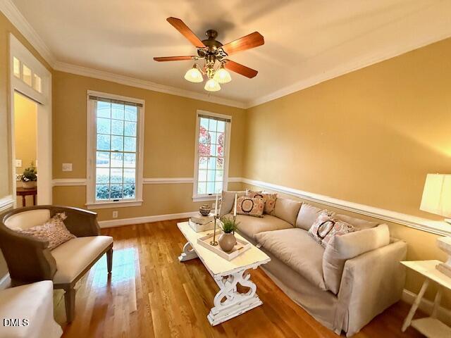 534 Dink Ashley Road Timberlake, NC 27583 - Photo 25 of 86 a living room with furniture and wooden floor