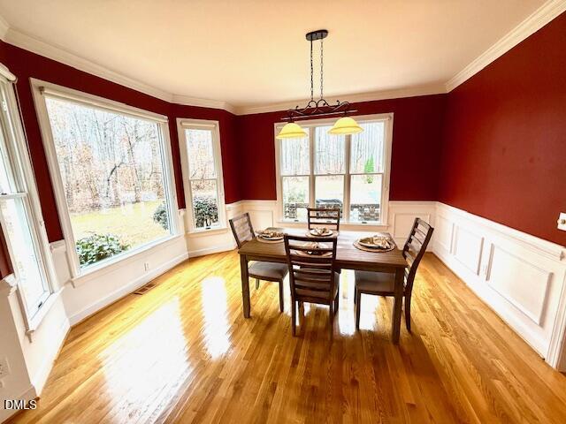 534 Dink Ashley Road Timberlake, NC 27583 - Photo 26 of 86 a view of a dining room with furniture window and wooden floor