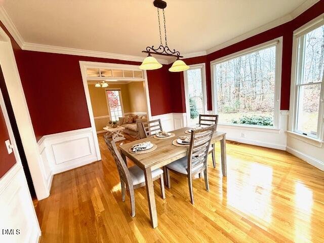534 Dink Ashley Road Timberlake, NC 27583 - Photo 28 of 86 a view of a dining room with furniture window and wooden floor