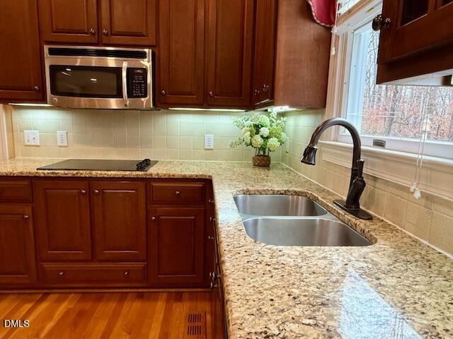 534 Dink Ashley Road Timberlake, NC 27583 - Photo 31 of 86 a kitchen with a sink and a microwave