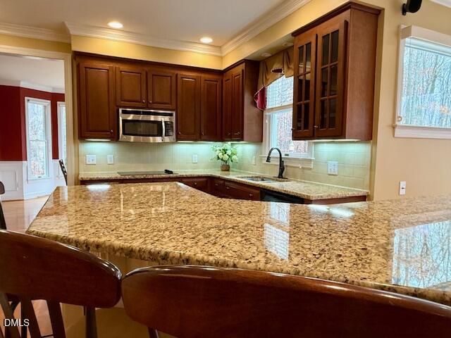 534 Dink Ashley Road Timberlake, NC 27583 - Photo 34 of 86 a kitchen with kitchen island granite countertop a sink stove and microwave