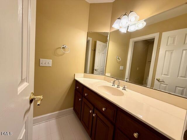 534 Dink Ashley Road Timberlake, NC 27583 - Photo 62 of 86 a spacious bathroom with a double vanity sink and a mirror