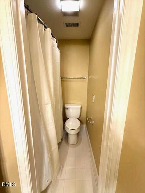 534 Dink Ashley Road Timberlake, NC 27583 - Photo 63 of 86 a bathroom with a toilet and a shower