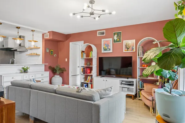 a view of livingroom with furniture and book shelf