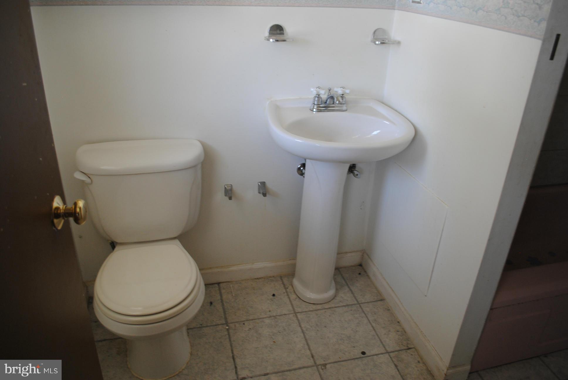 1941 Winder Road Baltimore, MD 21244 - Photo 20 of 22 a white toilet sitting next to a white sink