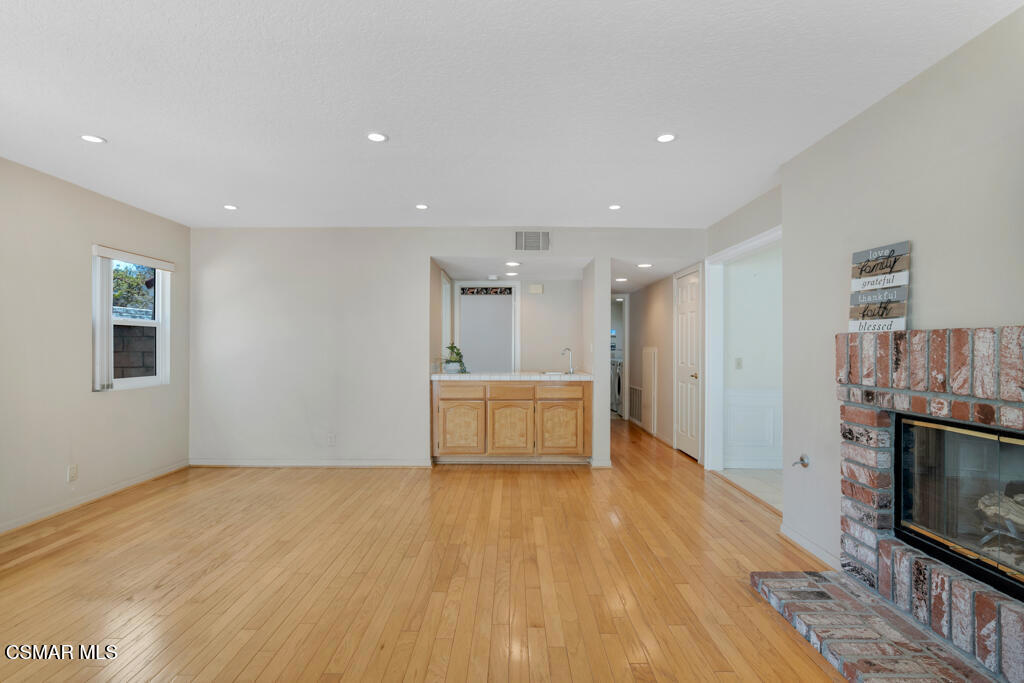 5339 Seneca Place Simi Valley, CA 93063 - Photo 32 of 76 a view of an empty room with wooden floor and a window