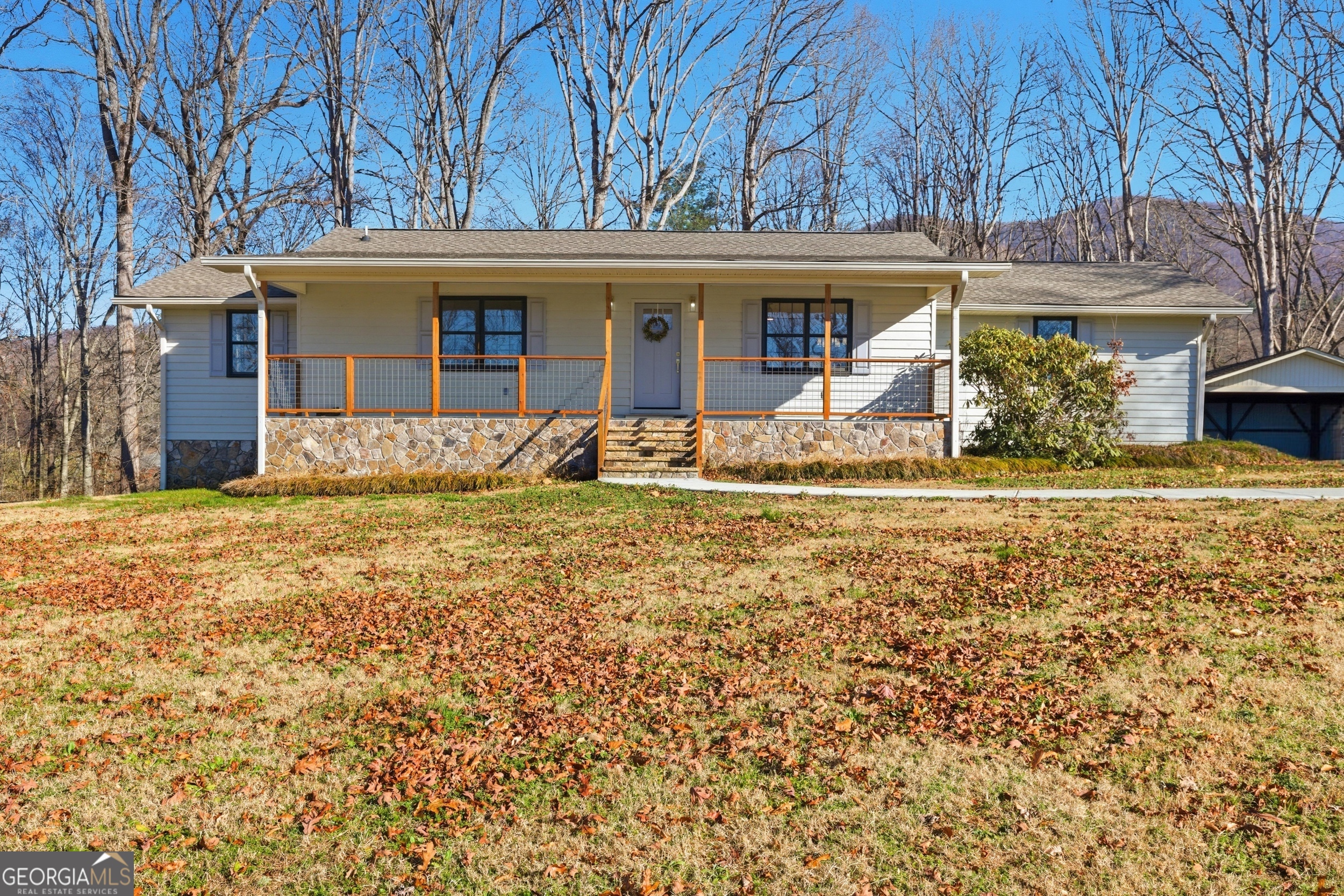 1664 Bell Gap Road Hiawassee, GA 30546 - Photo 1 of 42 front view of a house with a large tree
