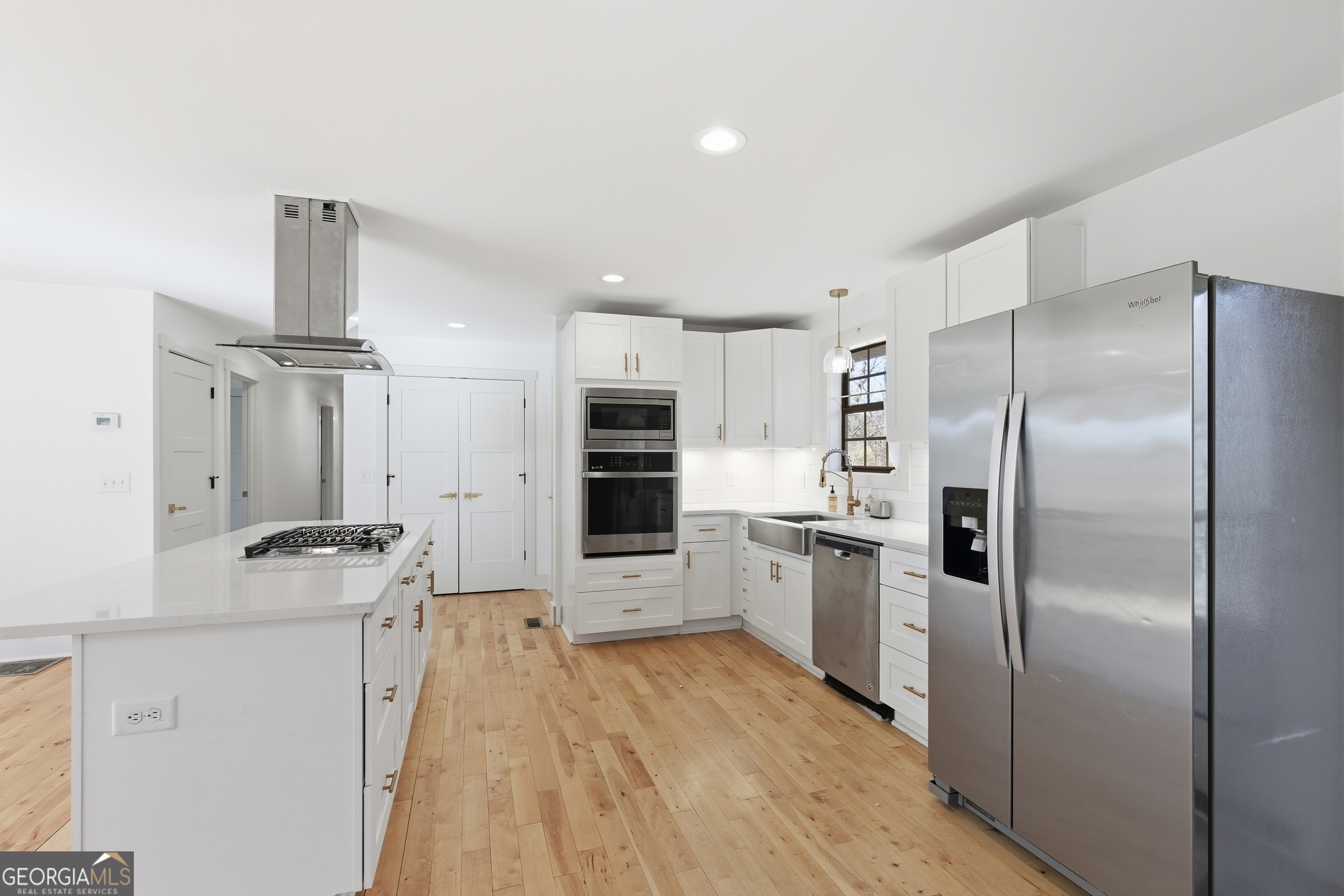 1664 Bell Gap Road Hiawassee, GA 30546 - Photo 11 of 42 a kitchen with stainless steel appliances granite countertop a refrigerator and a stove top oven