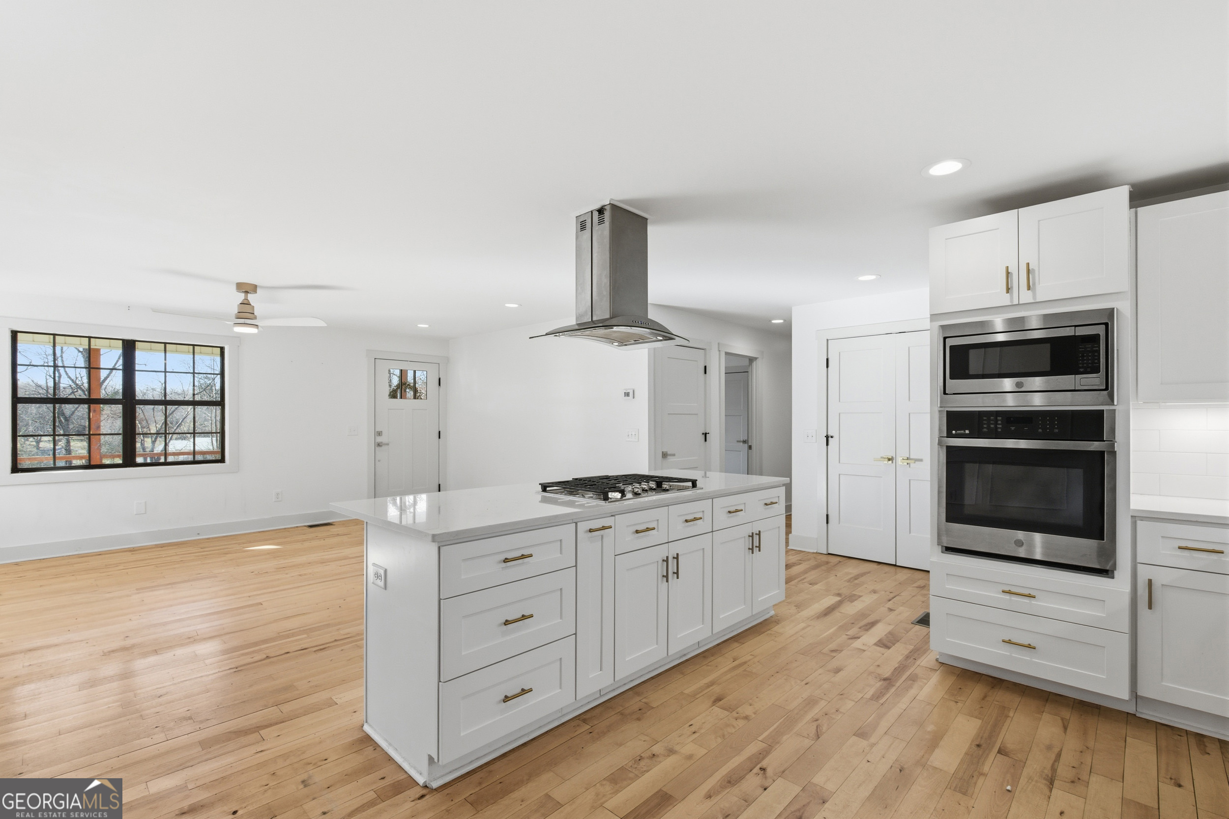 1664 Bell Gap Road Hiawassee, GA 30546 - Photo 12 of 42 a kitchen with stainless steel appliances granite countertop a stove and a refrigerator