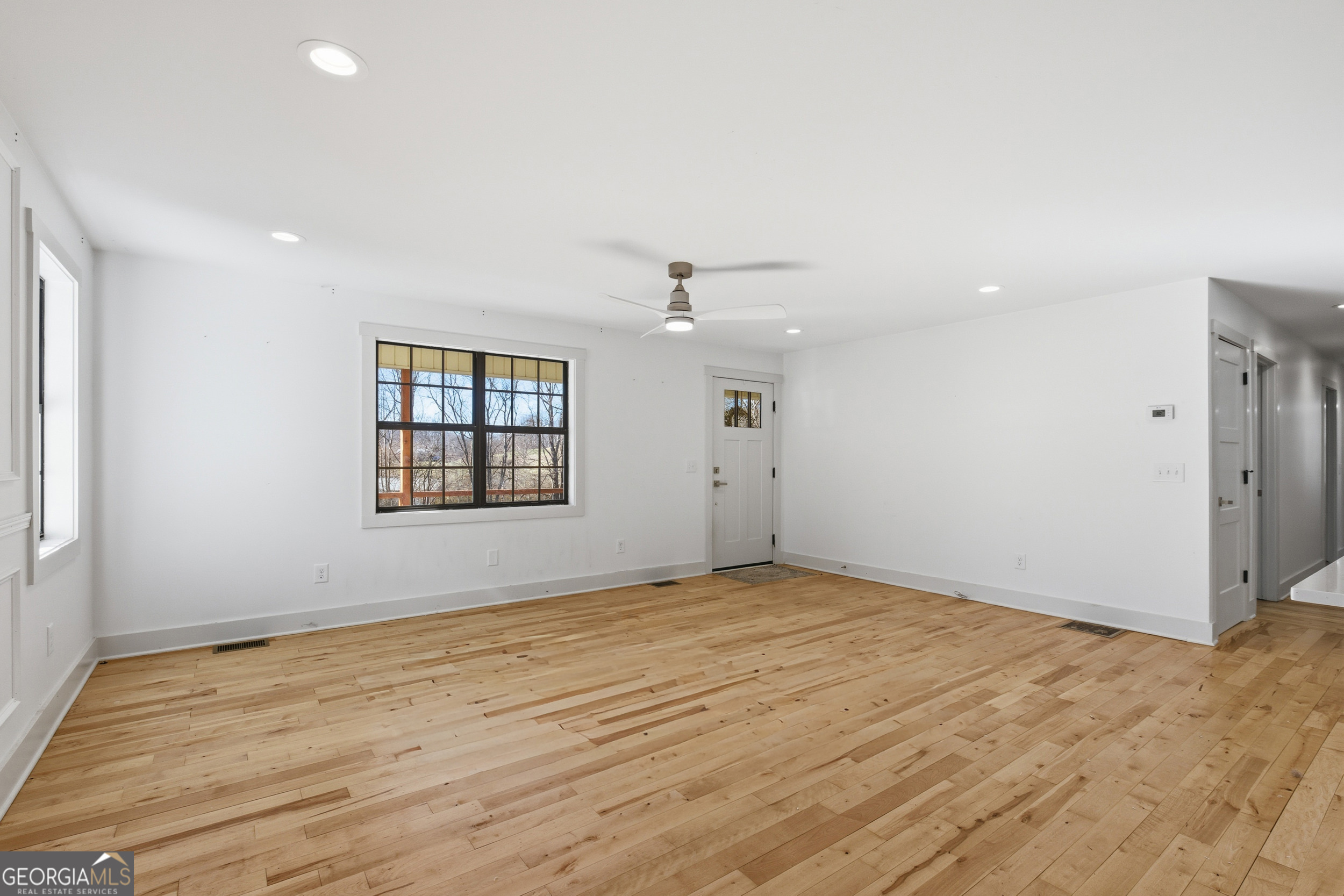 1664 Bell Gap Road Hiawassee, GA 30546 - Photo 15 of 42 wooden floor in an empty room with a window