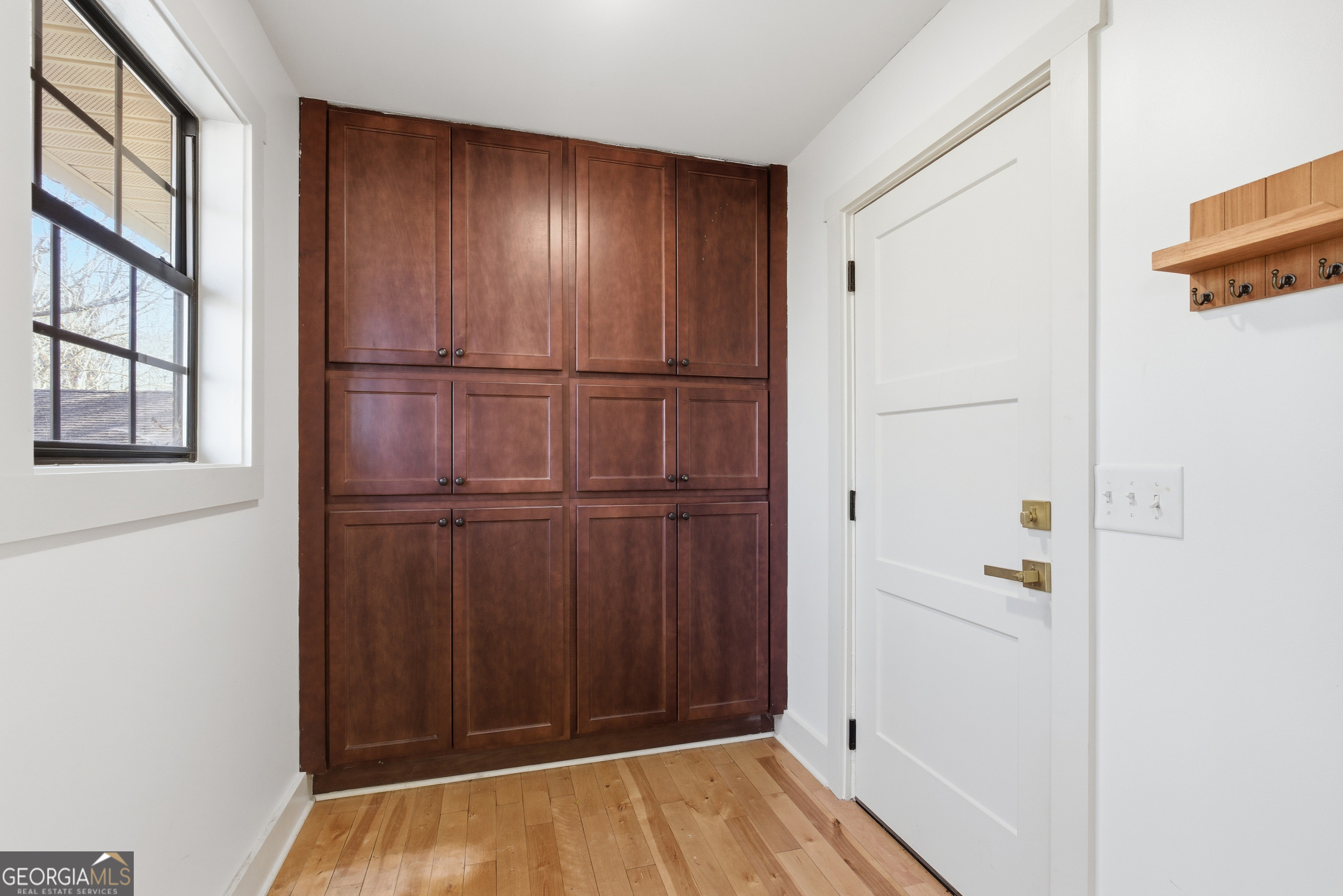 1664 Bell Gap Road Hiawassee, GA 30546 - Photo 16 of 42 a view of a hallway with wooden floor and entryway
