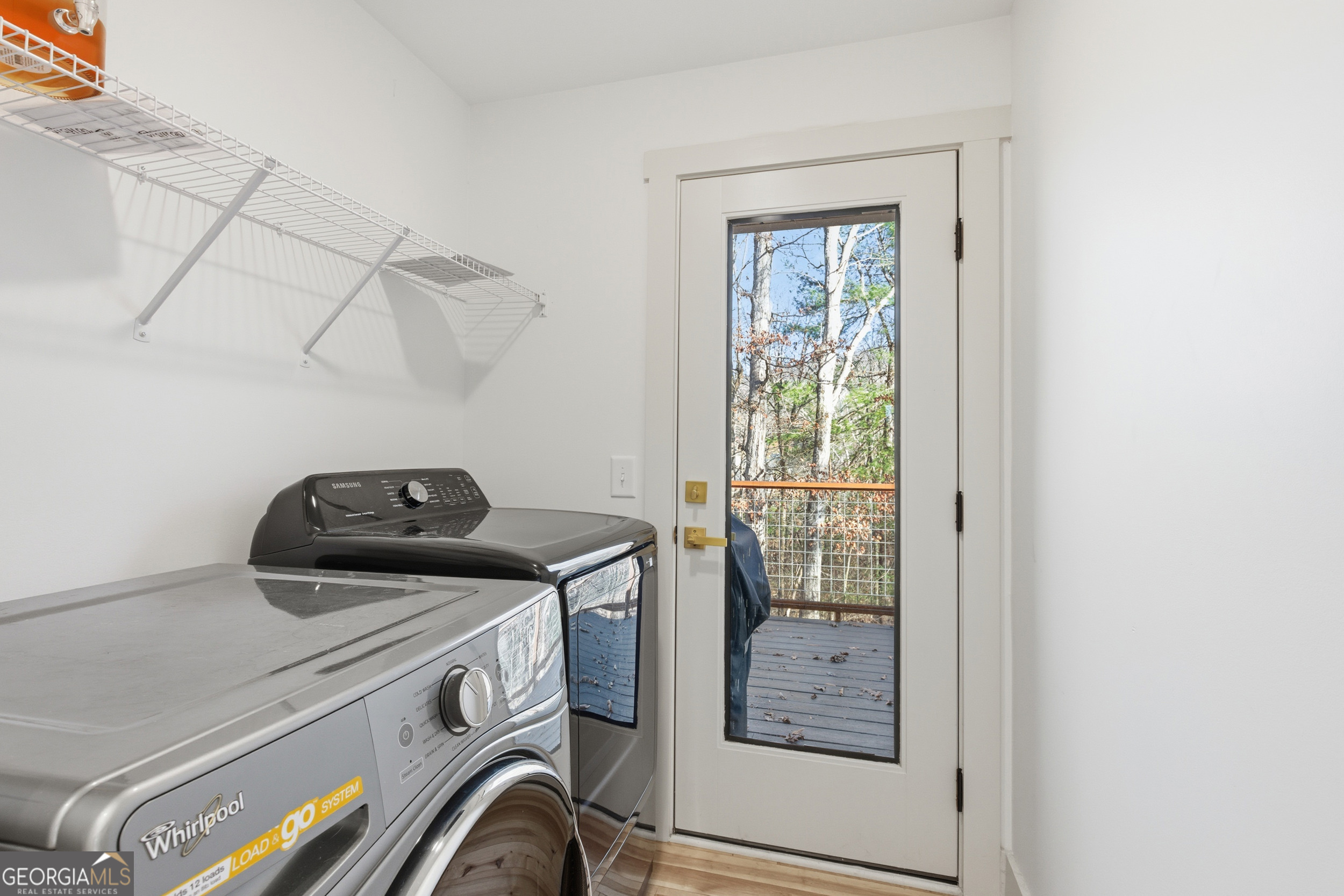 1664 Bell Gap Road Hiawassee, GA 30546 - Photo 17 of 42 a utility room with dryer and washer