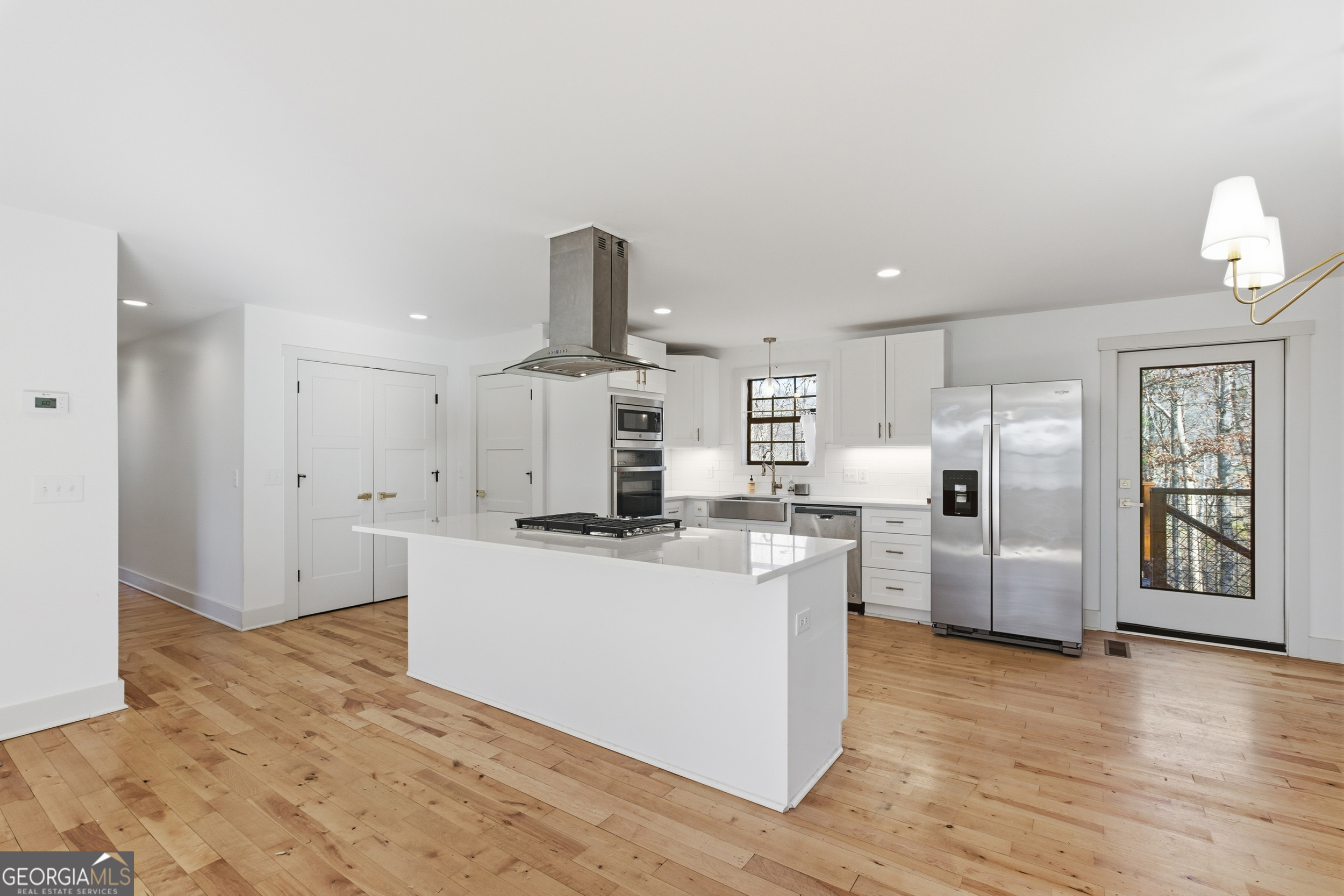 1664 Bell Gap Road Hiawassee, GA 30546 - Photo 2 of 42 a kitchen with refrigerator and cabinets