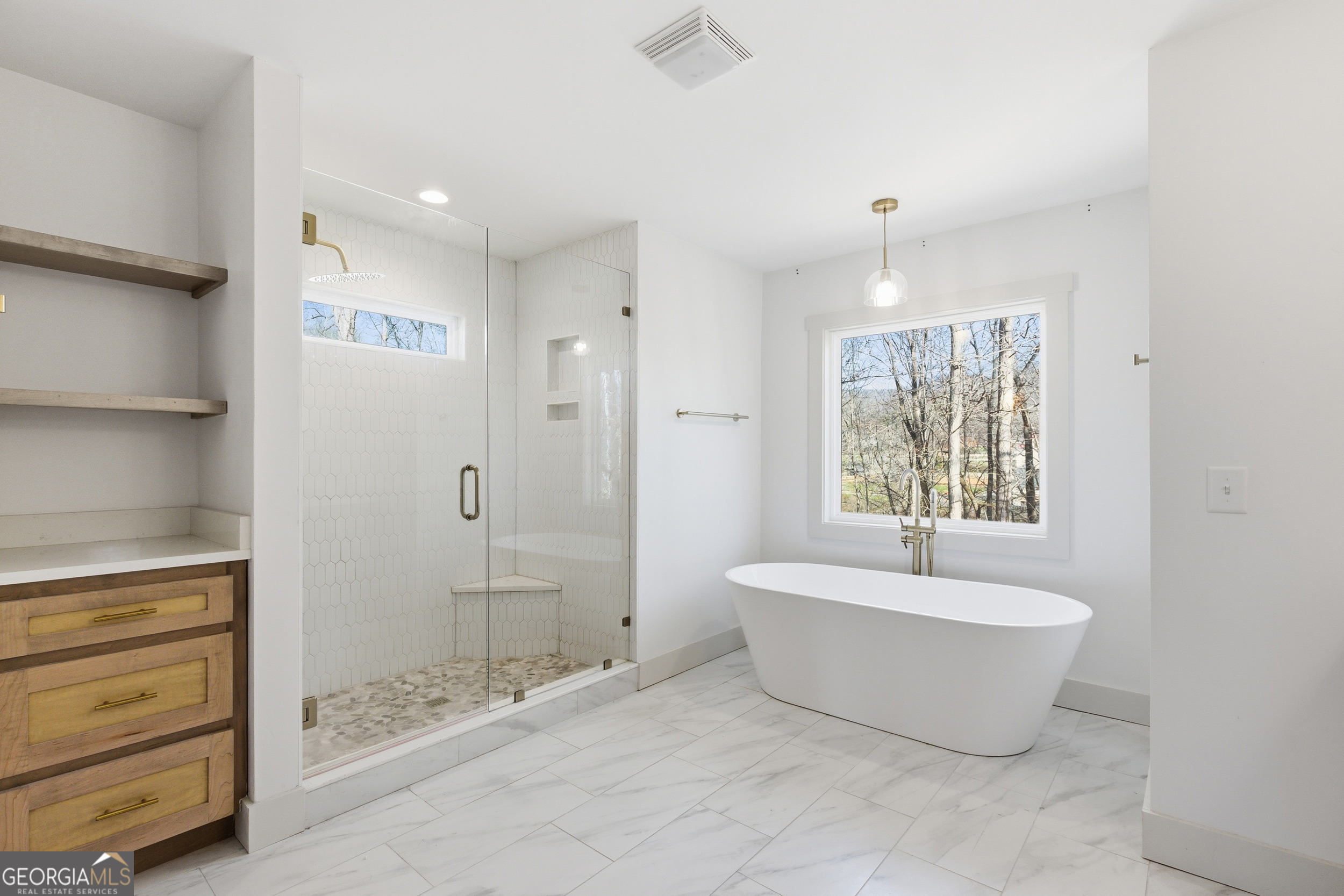 1664 Bell Gap Road Hiawassee, GA 30546 - Photo 21 of 42 a bathroom with a bathtub and shower