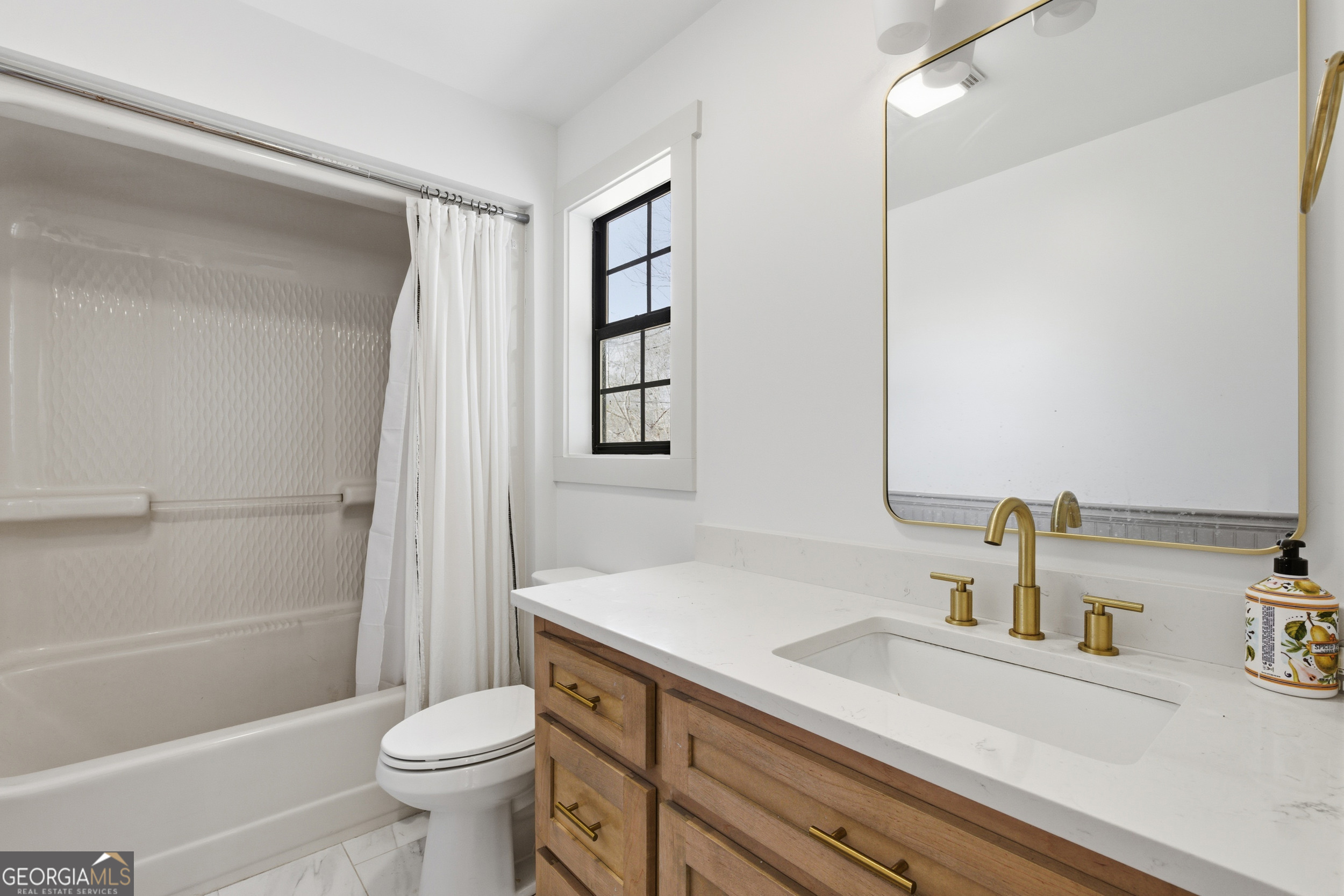 1664 Bell Gap Road Hiawassee, GA 30546 - Photo 28 of 42 a bathroom with a sink a toilet and shower