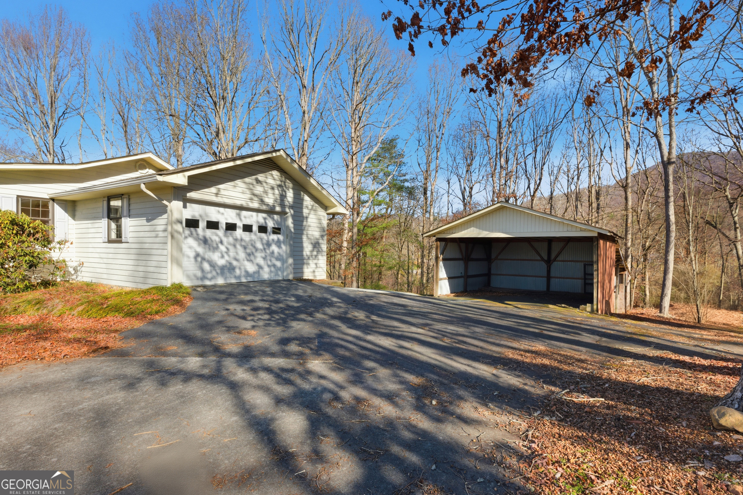 1664 Bell Gap Road Hiawassee, GA 30546 - Photo 33 of 42 a view of a house with a yard