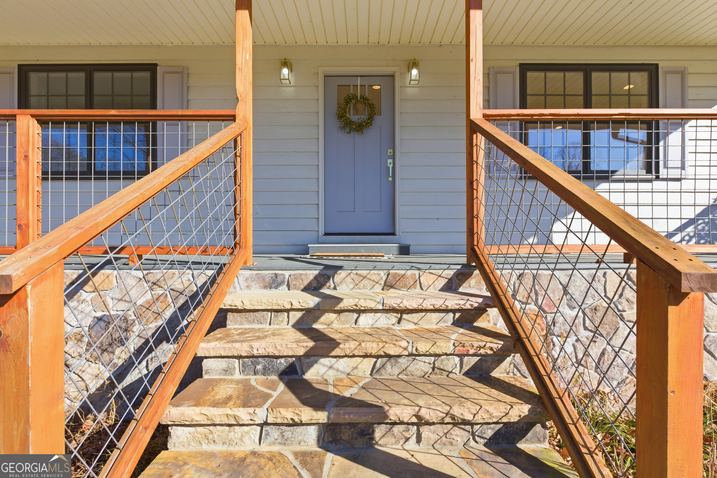 1664 Bell Gap Road Hiawassee, GA 30546 - Photo 7 of 42 a view of balcony with wooden floor and stairs
