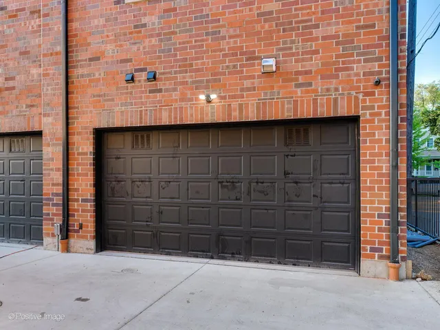 a front view of a house with a parking space