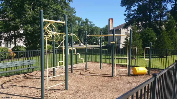 a swimming pool with outdoor seating and yard
