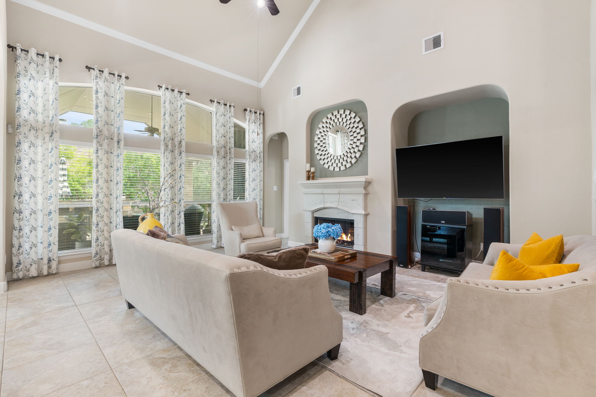 11 Pintuck Place Spring, TX 77389 - Photo 9 of 40 a living room with furniture a large window and a fireplace