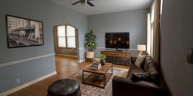 a living room with furniture and a flat screen tv