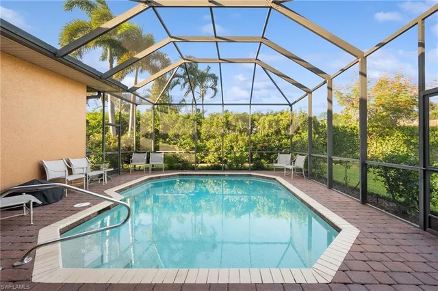 a swimming pool with a outdoor seating