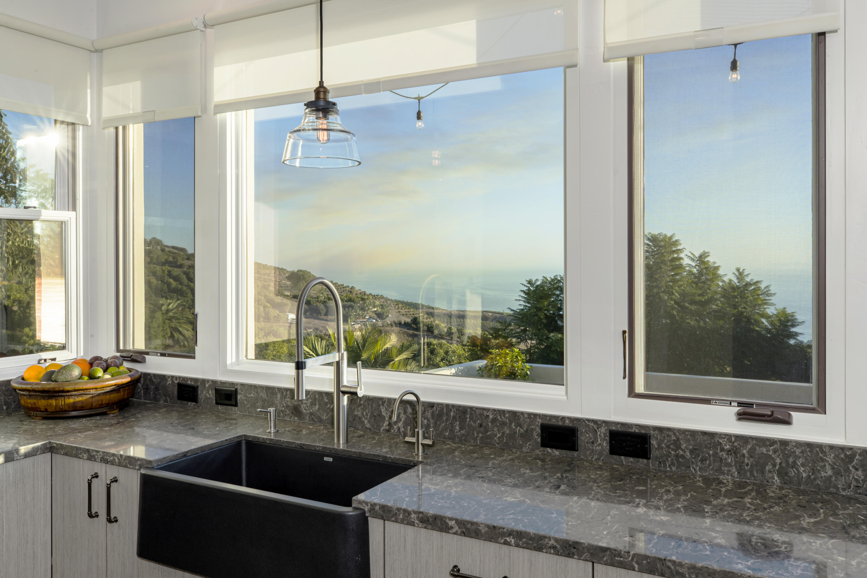 8517 Ocean View Road Ventura, CA 93001 - Photo 11 of 37 a kitchen with granite countertop a sink and a window
