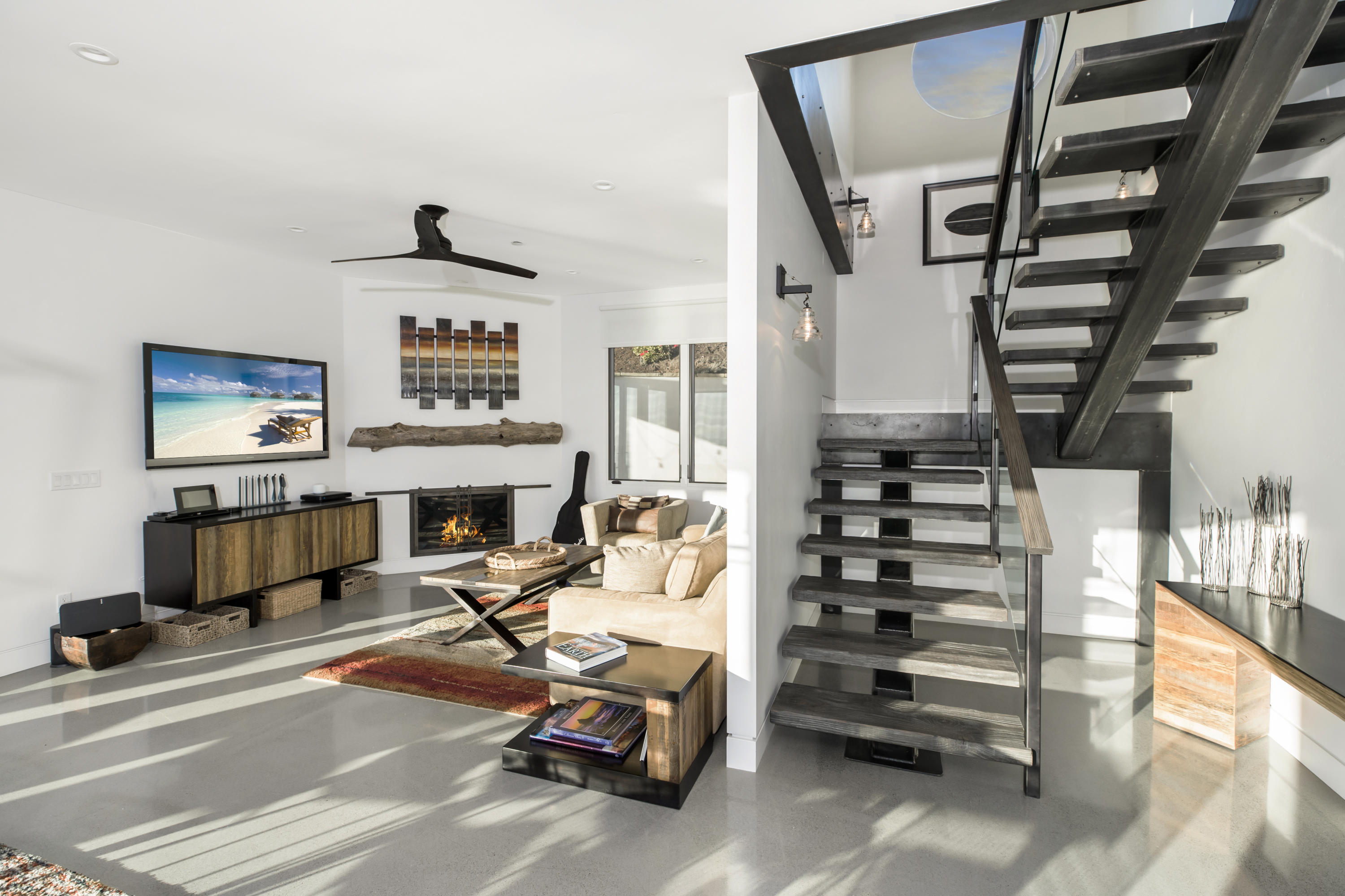 8517 Ocean View Road Ventura, CA 93001 - Photo 12 of 37 a view of a livingroom with furniture and staircase