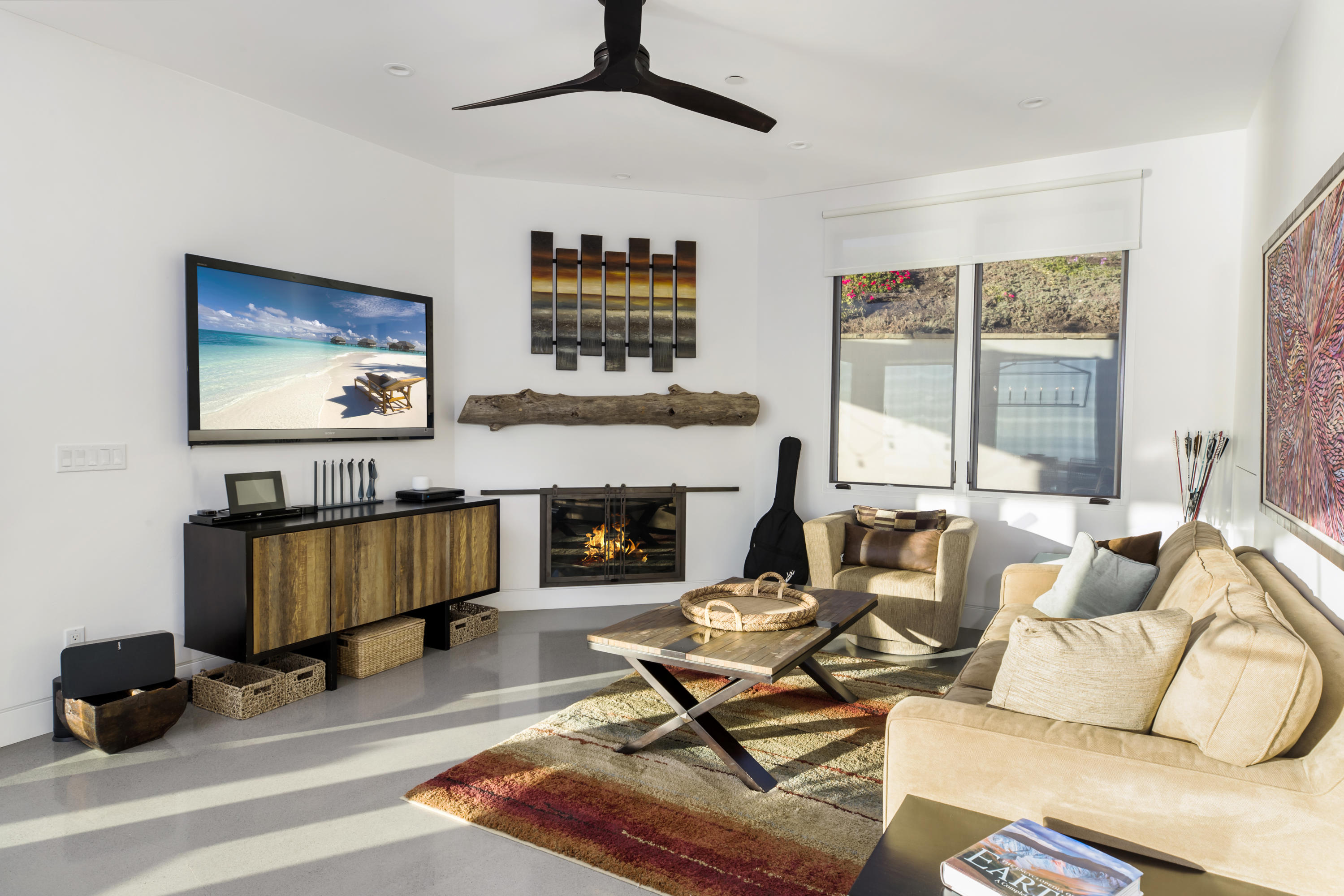 8517 Ocean View Road Ventura, CA 93001 - Photo 13 of 37 a living room with furniture and a fireplace