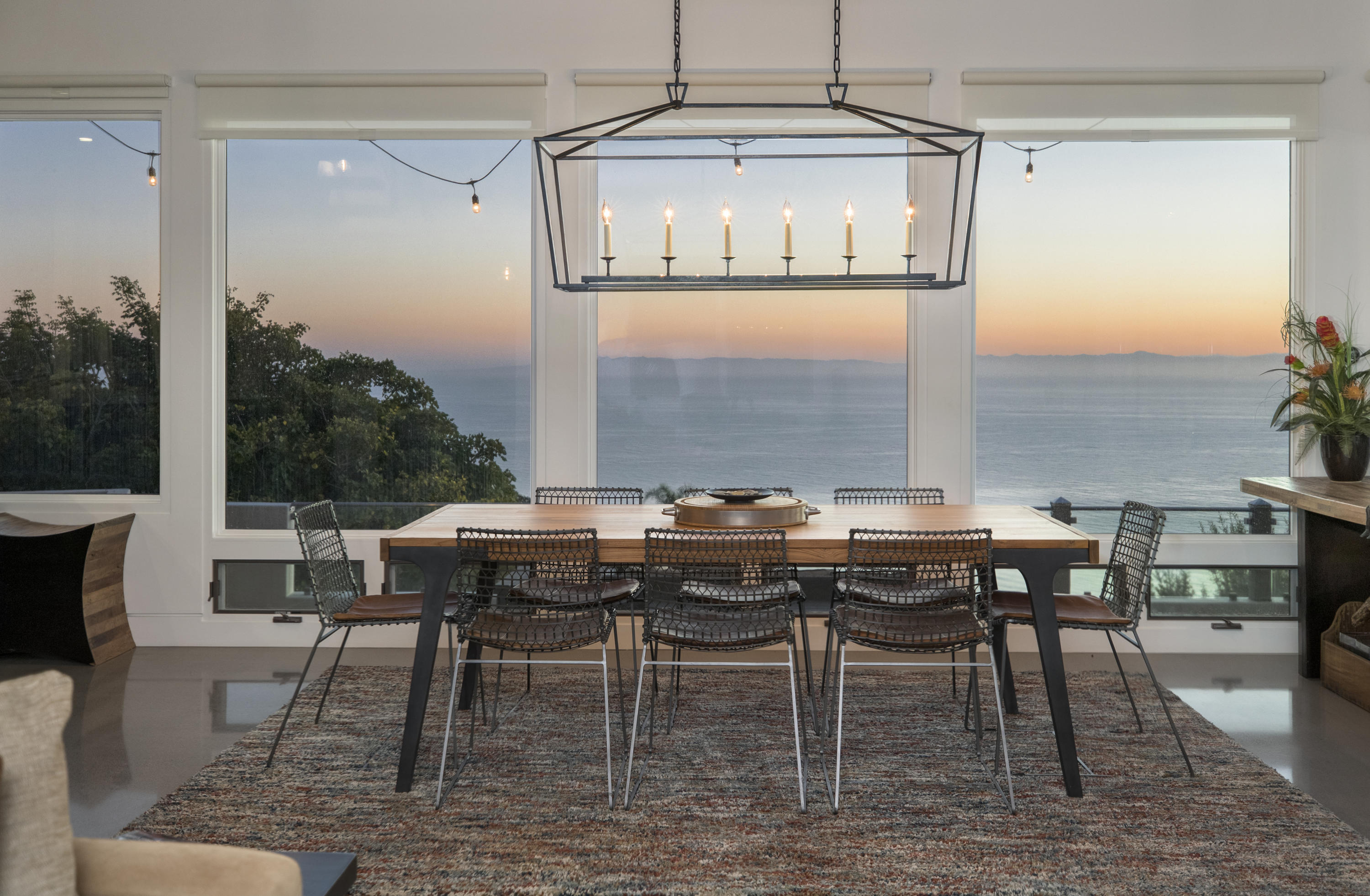 8517 Ocean View Road Ventura, CA 93001 - Photo 15 of 37 a view of a dining room with furniture window and outside view