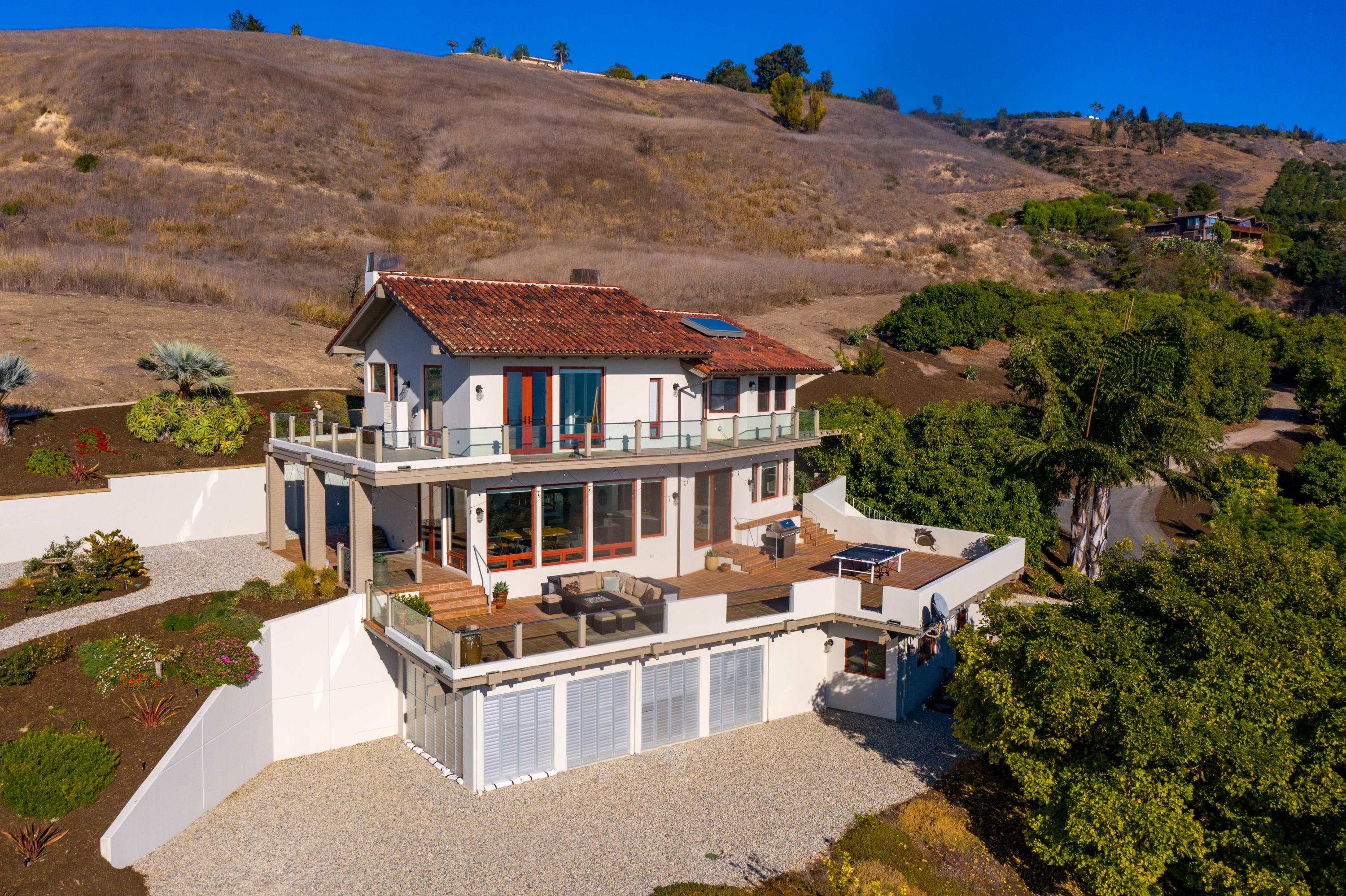 8517 Ocean View Road Ventura, CA 93001 - Photo 3 of 37 an aerial view of residential houses with outdoor space and trees
