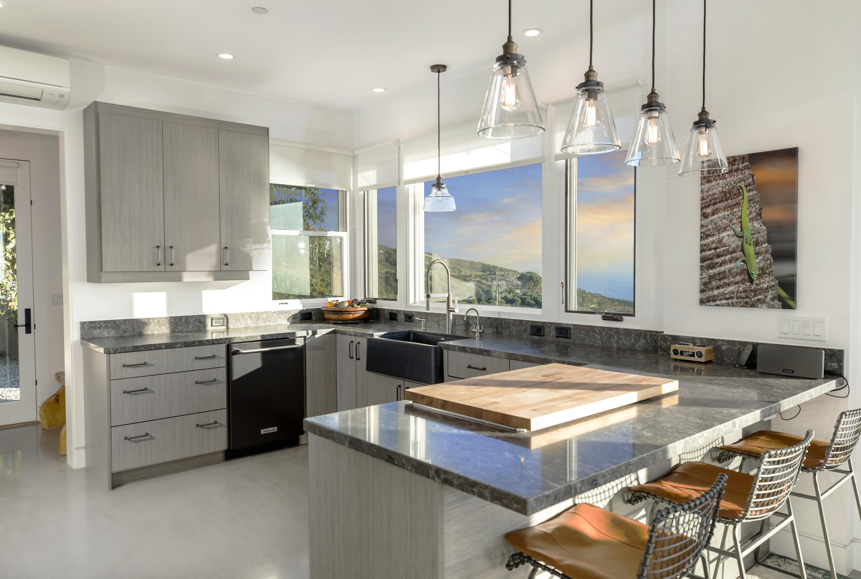 8517 Ocean View Road Ventura, CA 93001 - Photo 8 of 37 a living room with stainless steel appliances kitchen island granite countertop furniture and a kitchen view