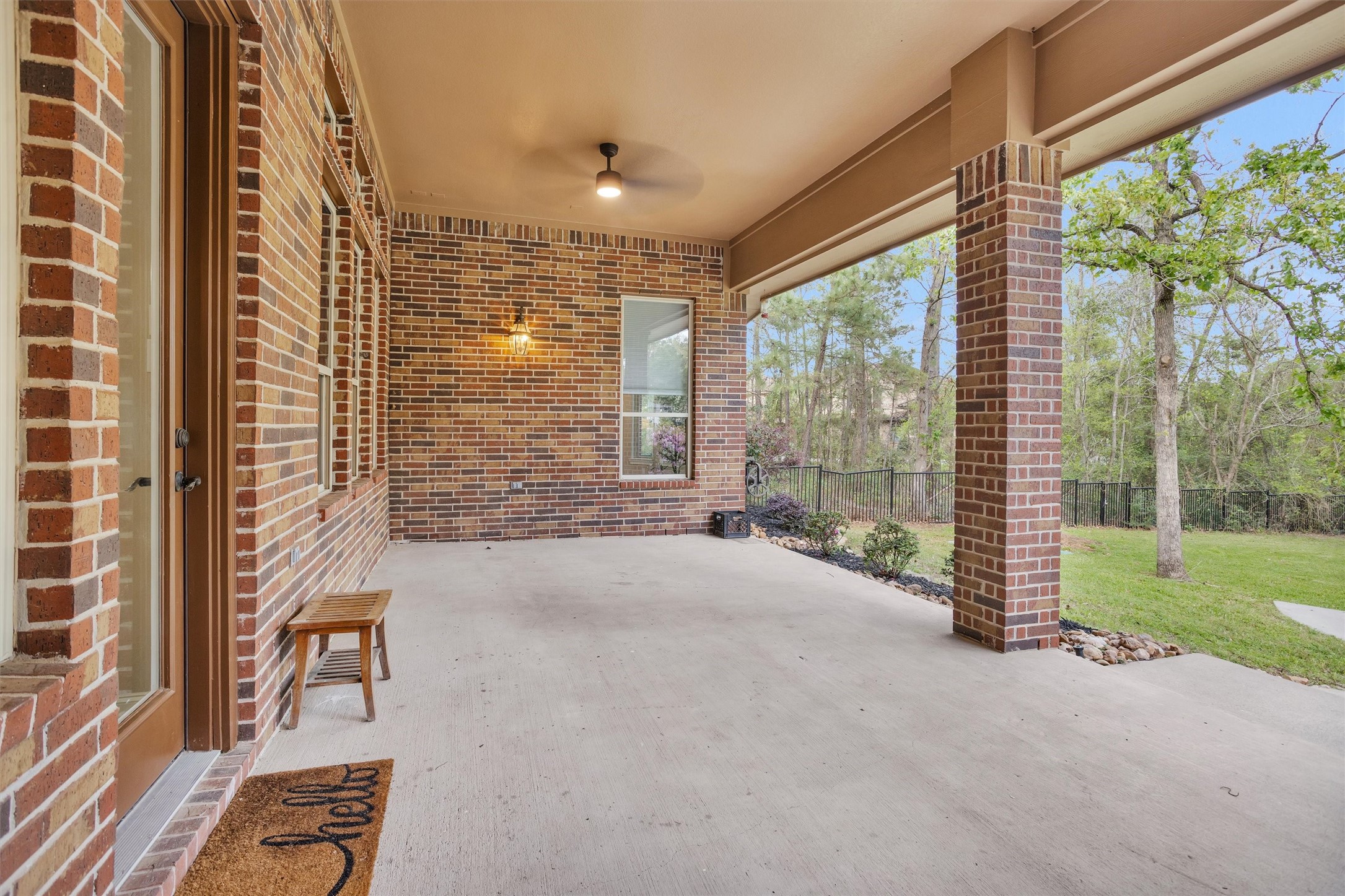 27910 Hansons Court Spring, TX 77386 - Photo 38 of 50 Oversized first floor back patio with dual fans overlooking the backyard landscape.