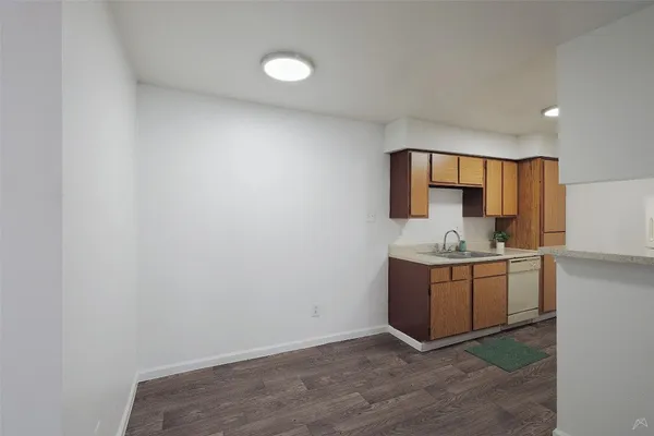 a room with a sink and a microwave