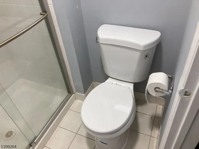 a white toilet sitting next to a sink