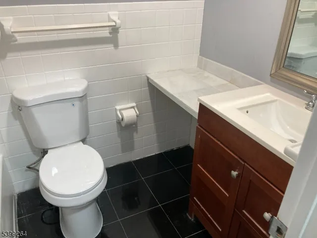a bathroom with a toilet and a sink