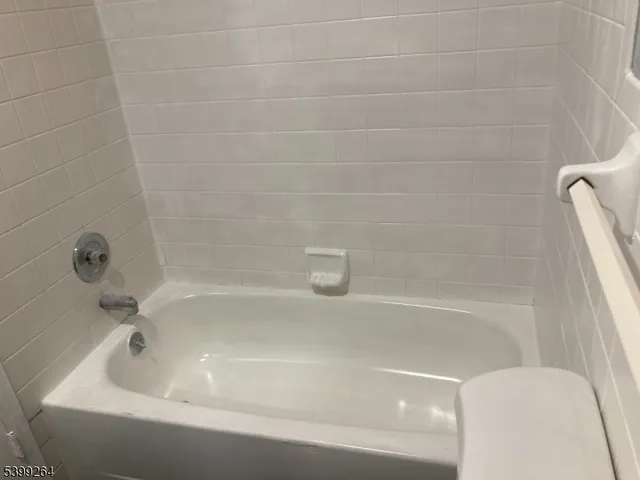 a close up of a bathtub in a bathroom