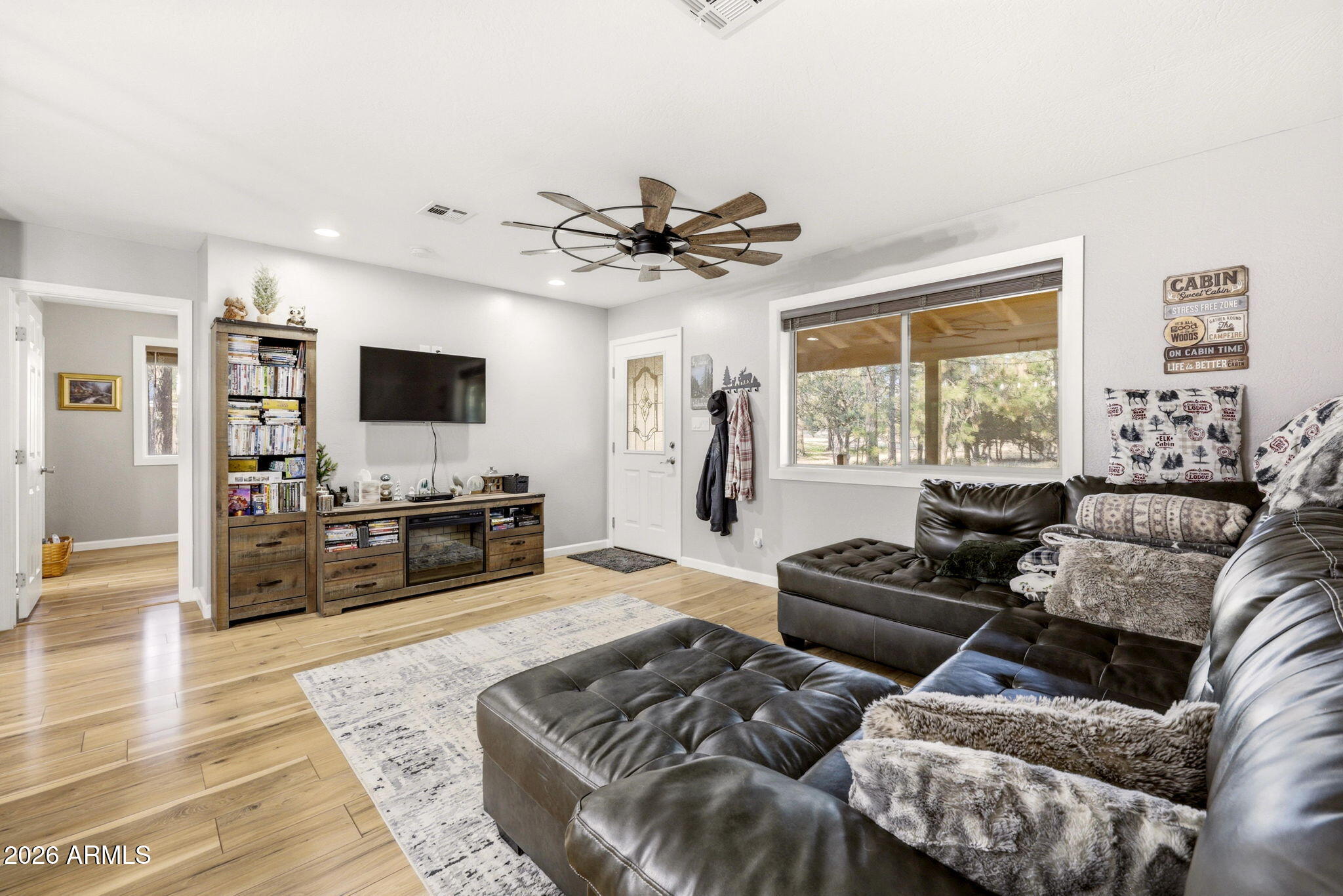 2900 Long Rifle Place Overgaard, AZ 85933 - Photo 7 of 35 a living room with furniture and a flat screen tv