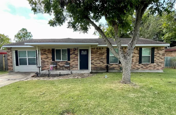 a view of a house with backyard porch and sitting area
