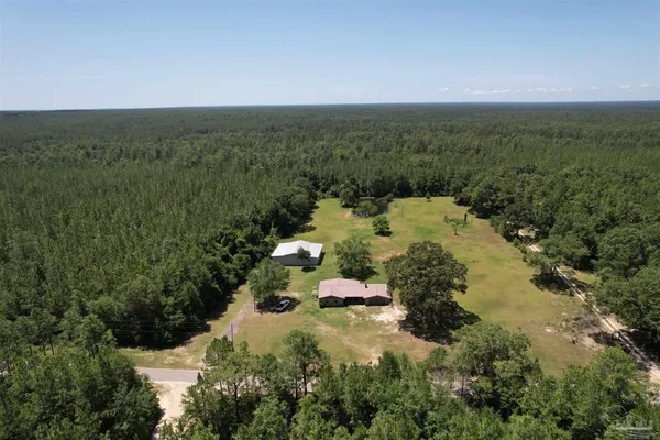 an aerial view of residential house with outdoor space