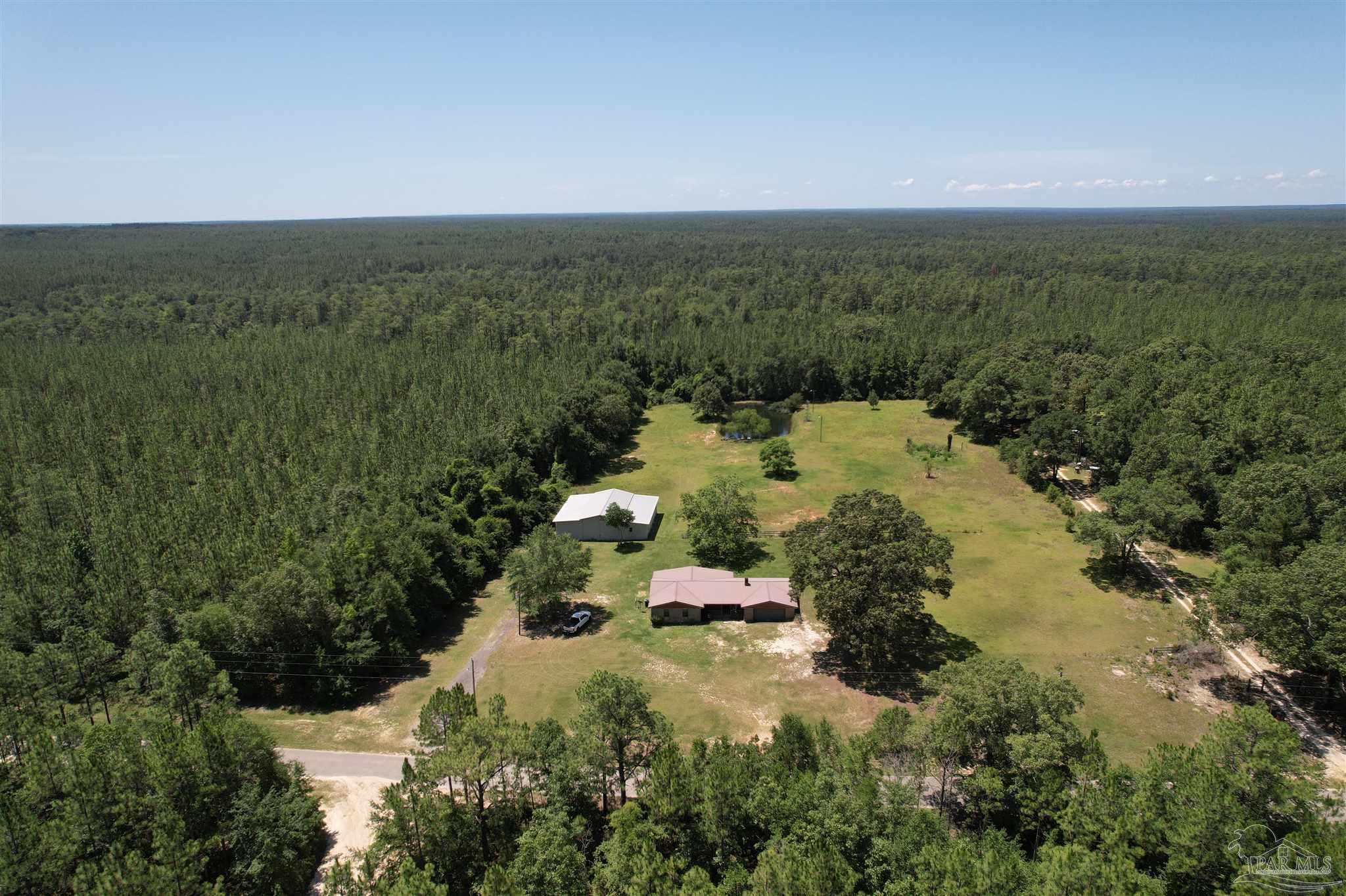 an aerial view of residential house with outdoor space