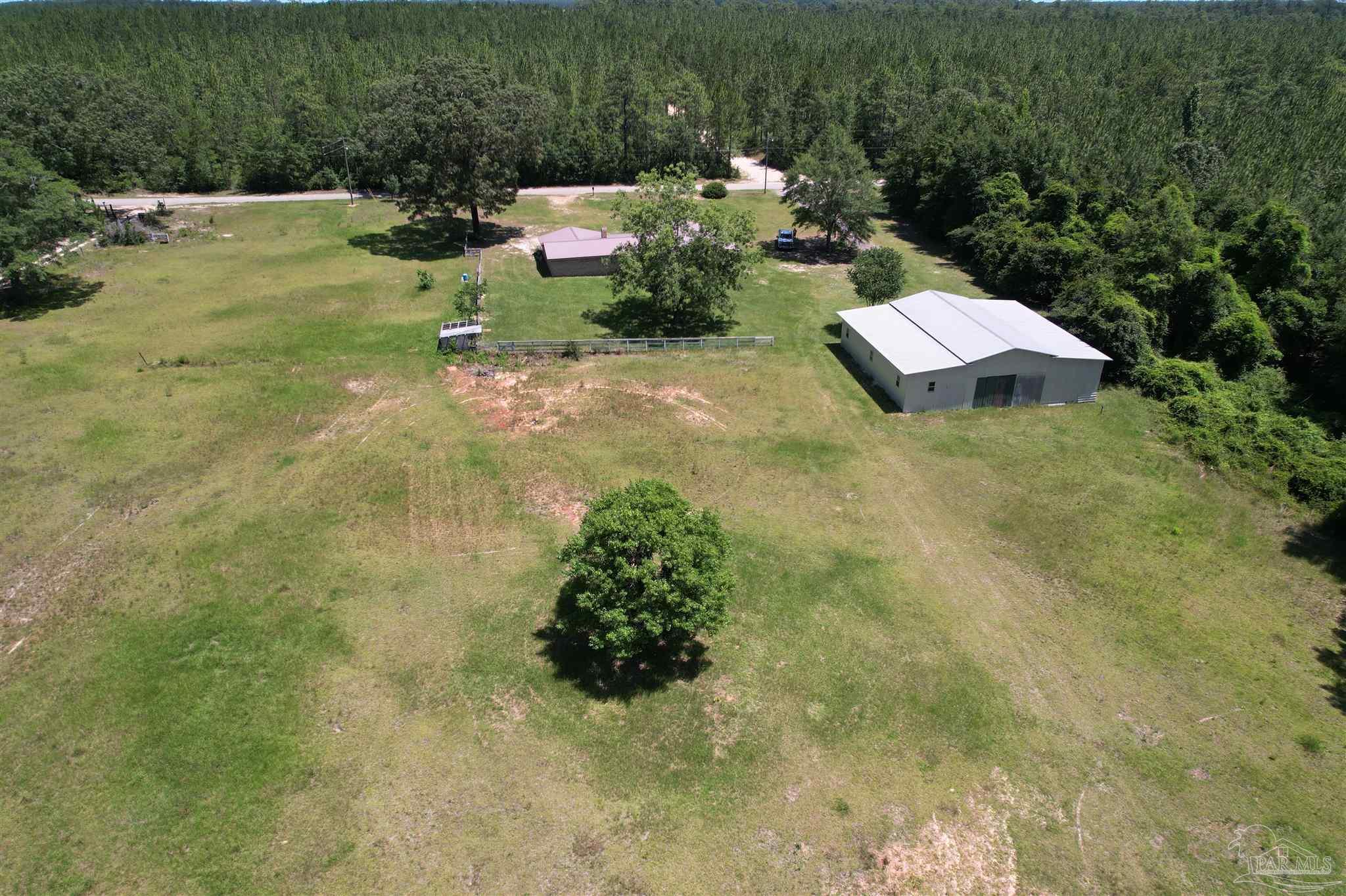 9353 Sellersville Road Jay, FL 32565 - Photo 12 of 26 an aerial view of residential house with outdoor space