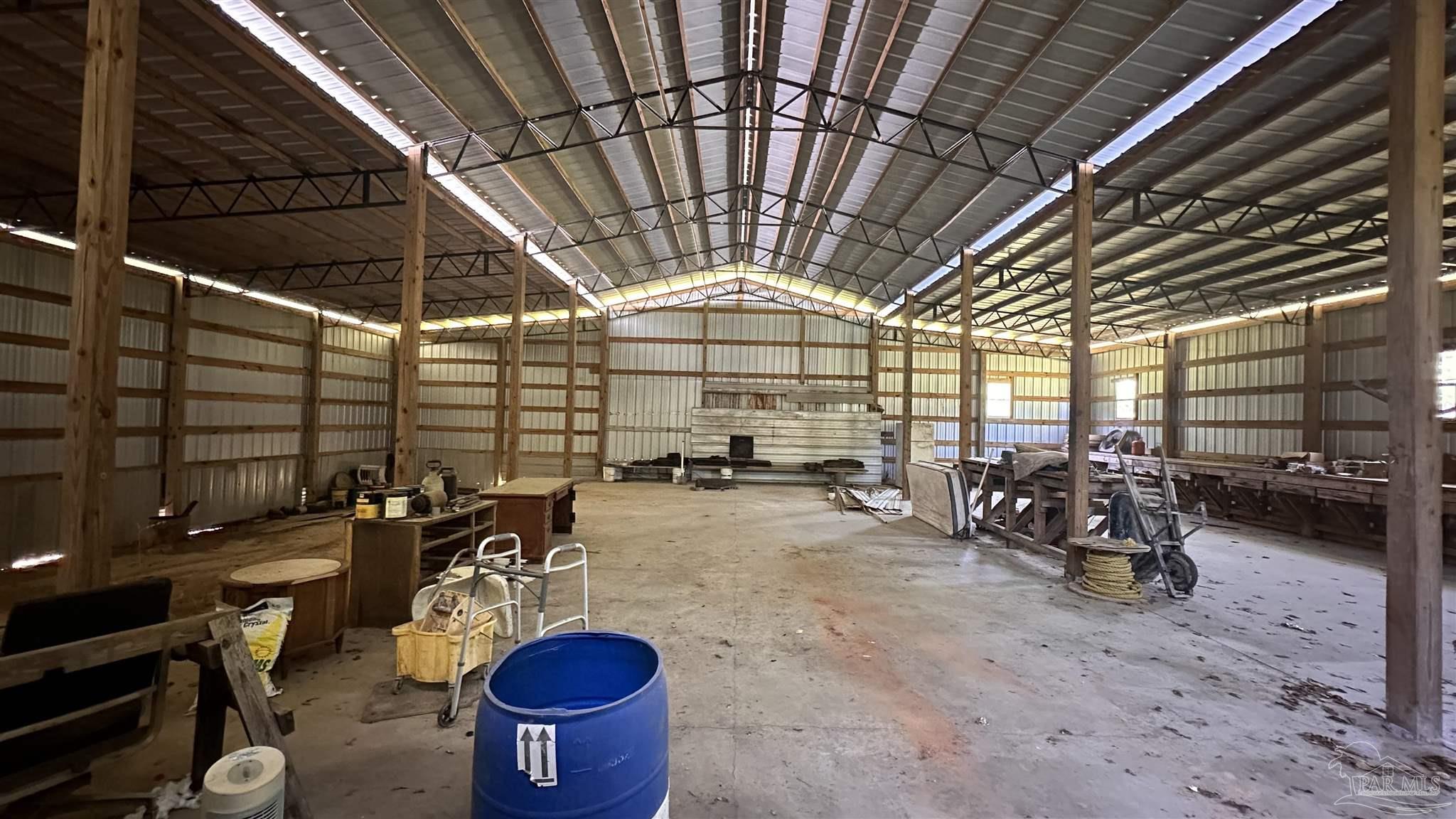 9353 Sellersville Road Jay, FL 32565 - Photo 22 of 26 a view of a room with gym equipment